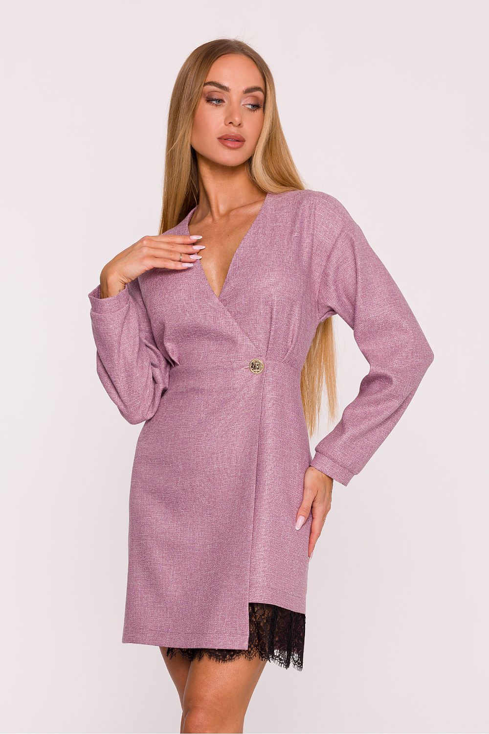 Woman wearing a purple dress with long sleeves on a white background