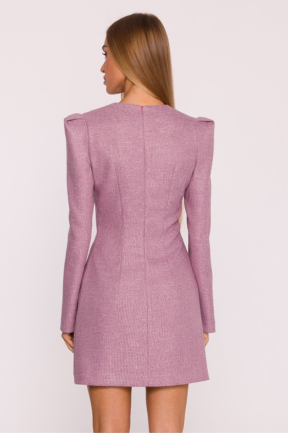 Pink dress worn by a model on a white background