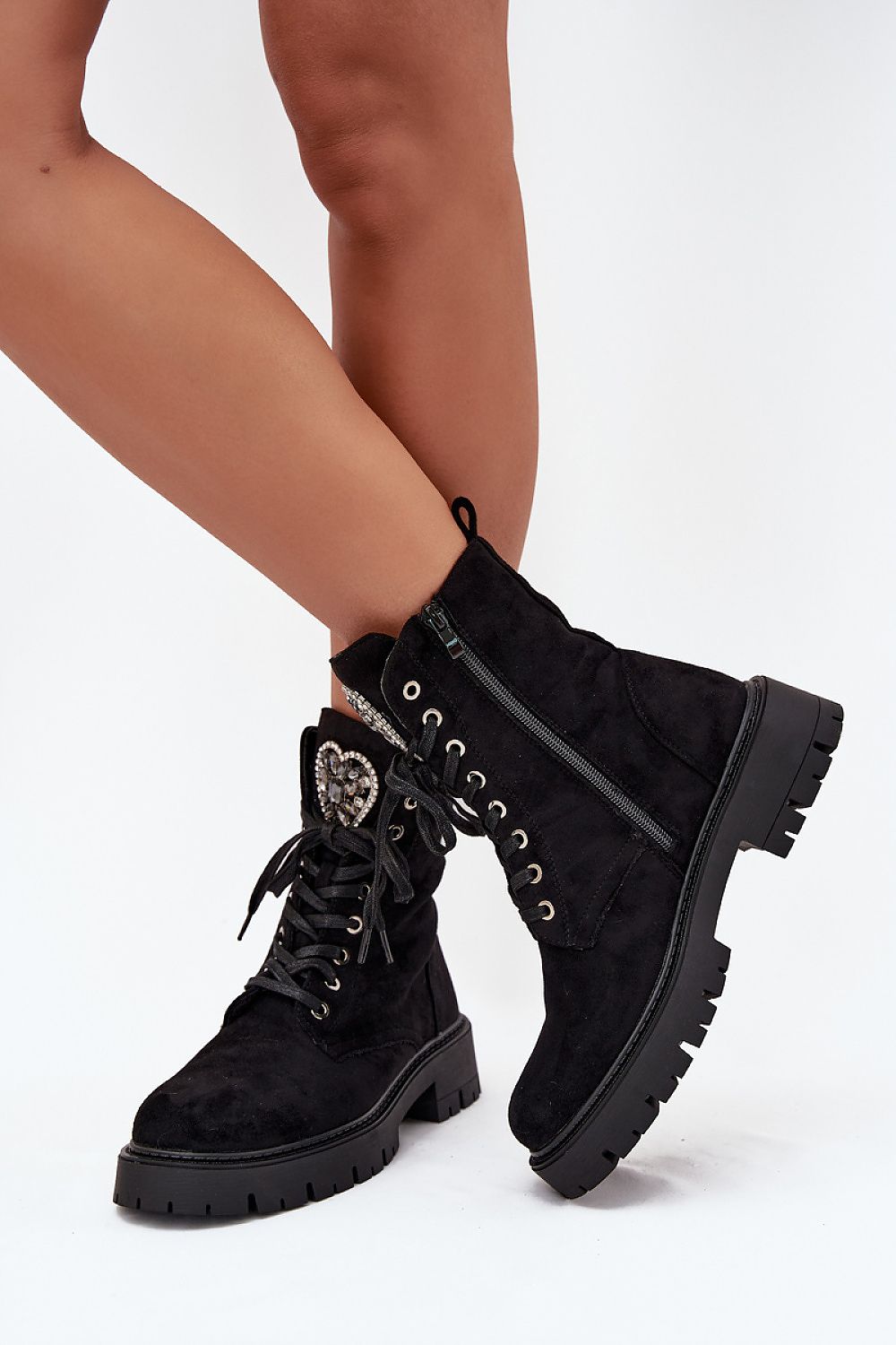  Angled view of women’s Black-2 eco-leather ankle boots with laces and zipper.