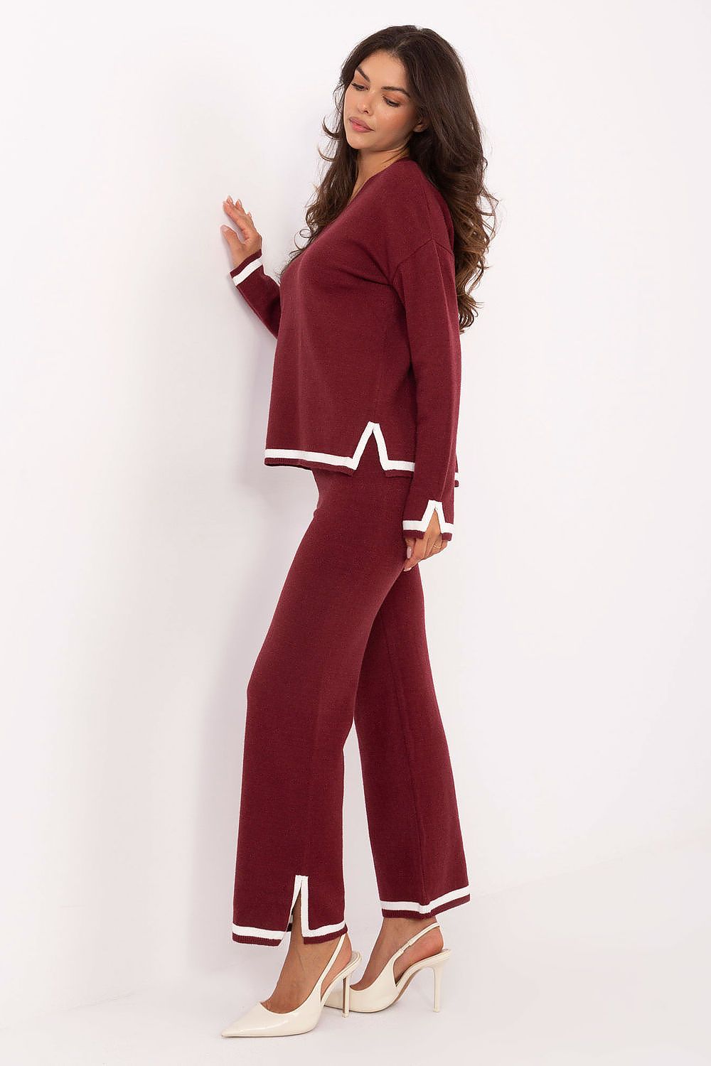 casual red v-neck sweater with high waist trousers