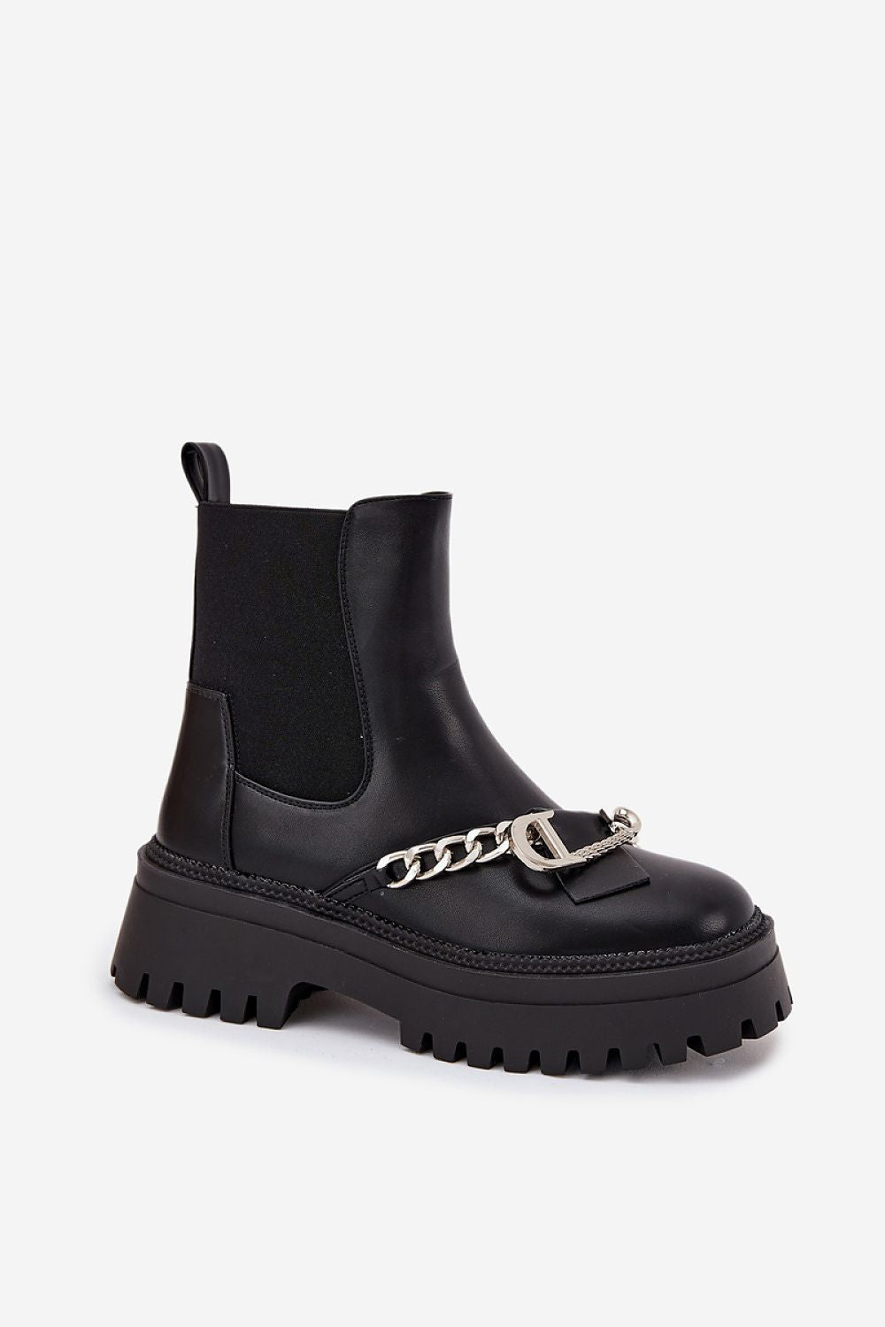 Standalone image of women’s ankle boots in eco leather, with rounded toes, fur lining, and platform heel for comfort.