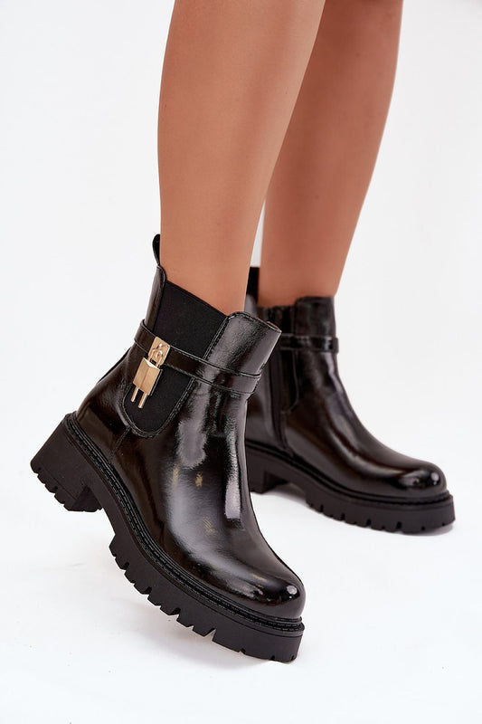 Front view of women’s eco-leather ankle boots with gold strap detail