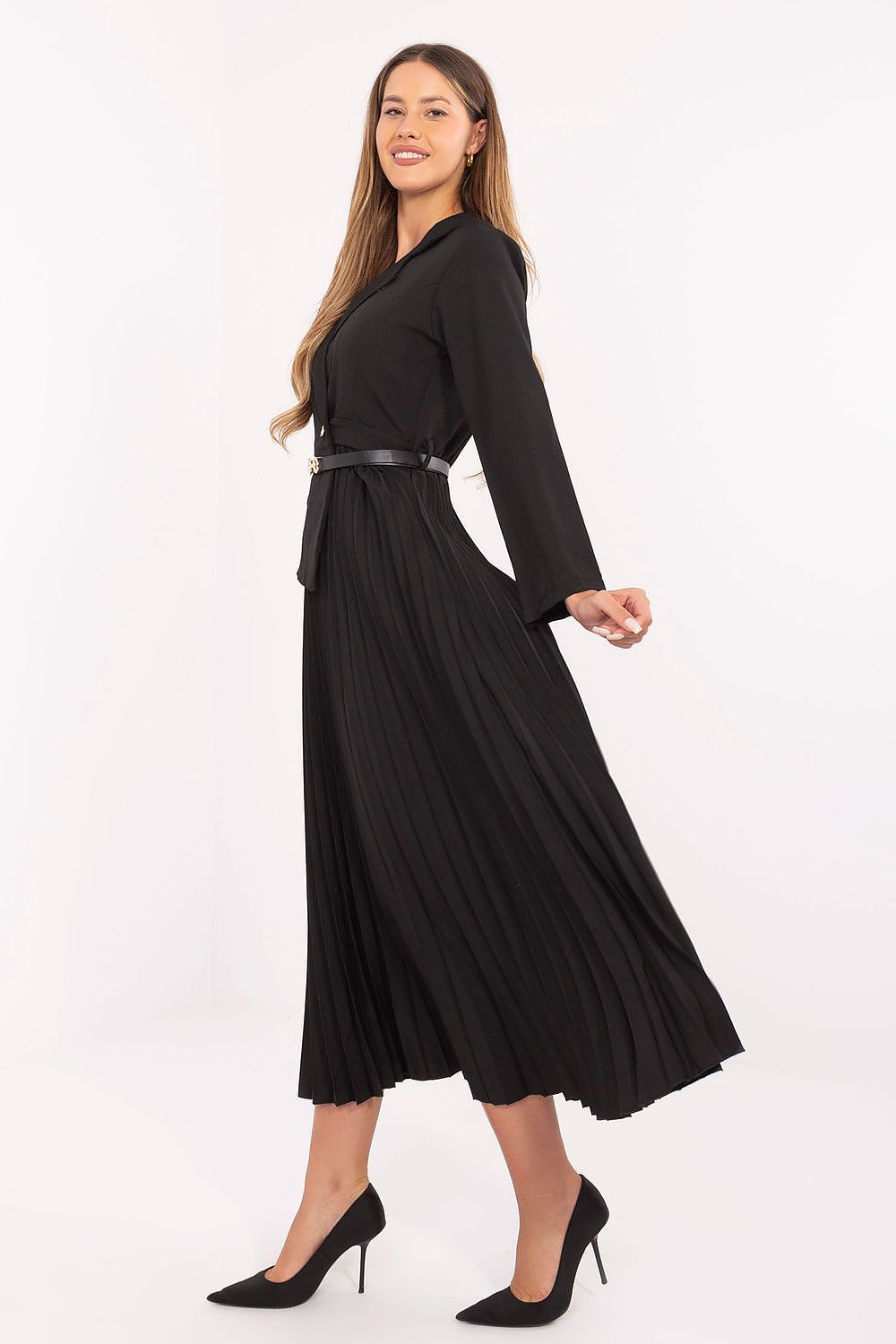  Side view – Flared maxi dress showing flowing pleated skirt and long sleeves.