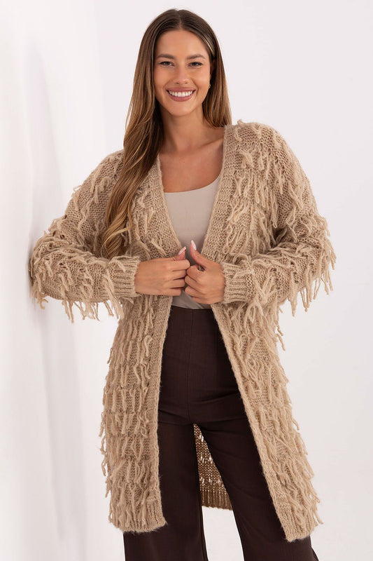 Front view of beige women’s fringed knit cardigan with long sleeves.