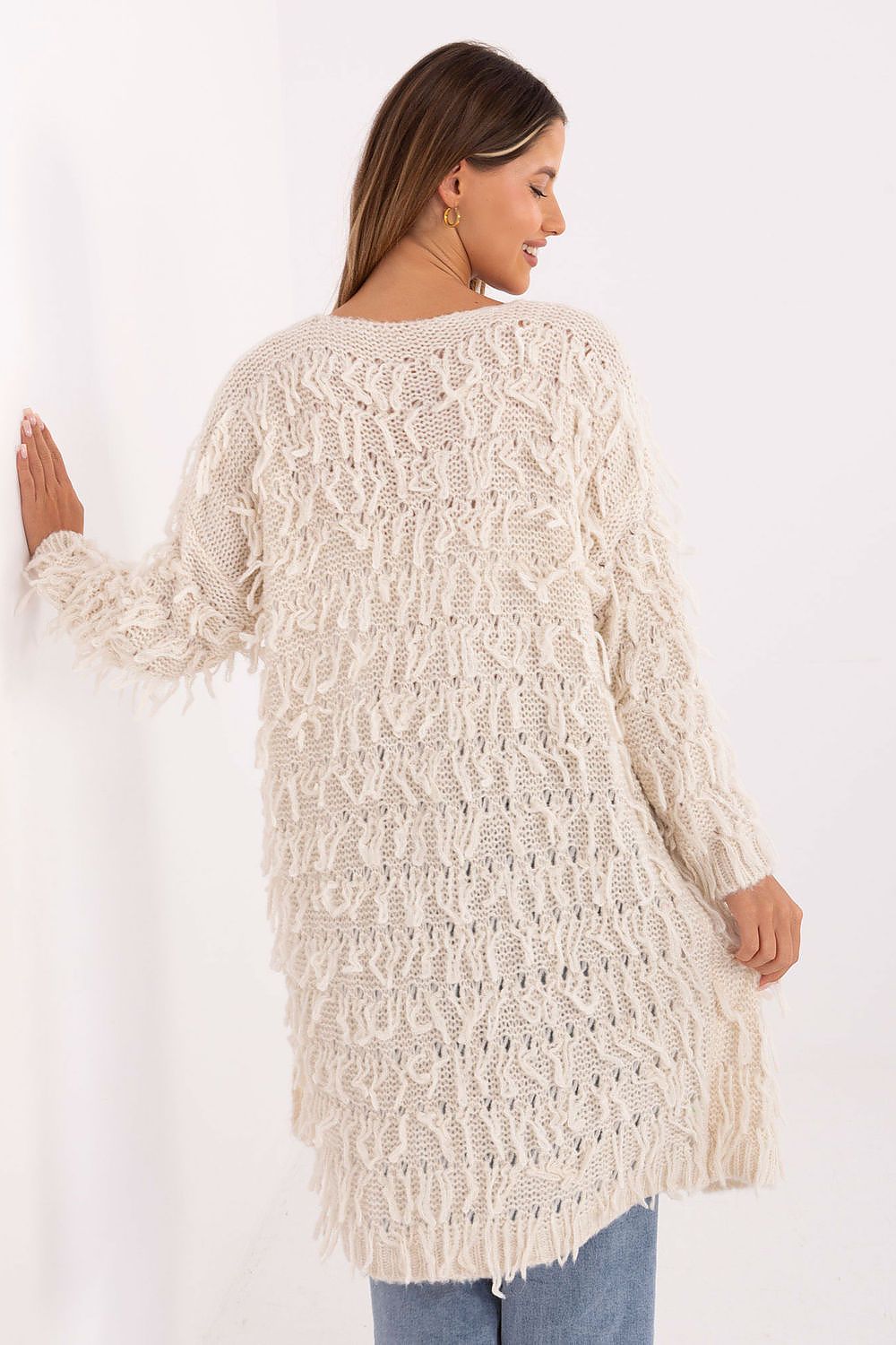  Back view of beige 2 knit cardigan highlighting textured pattern.