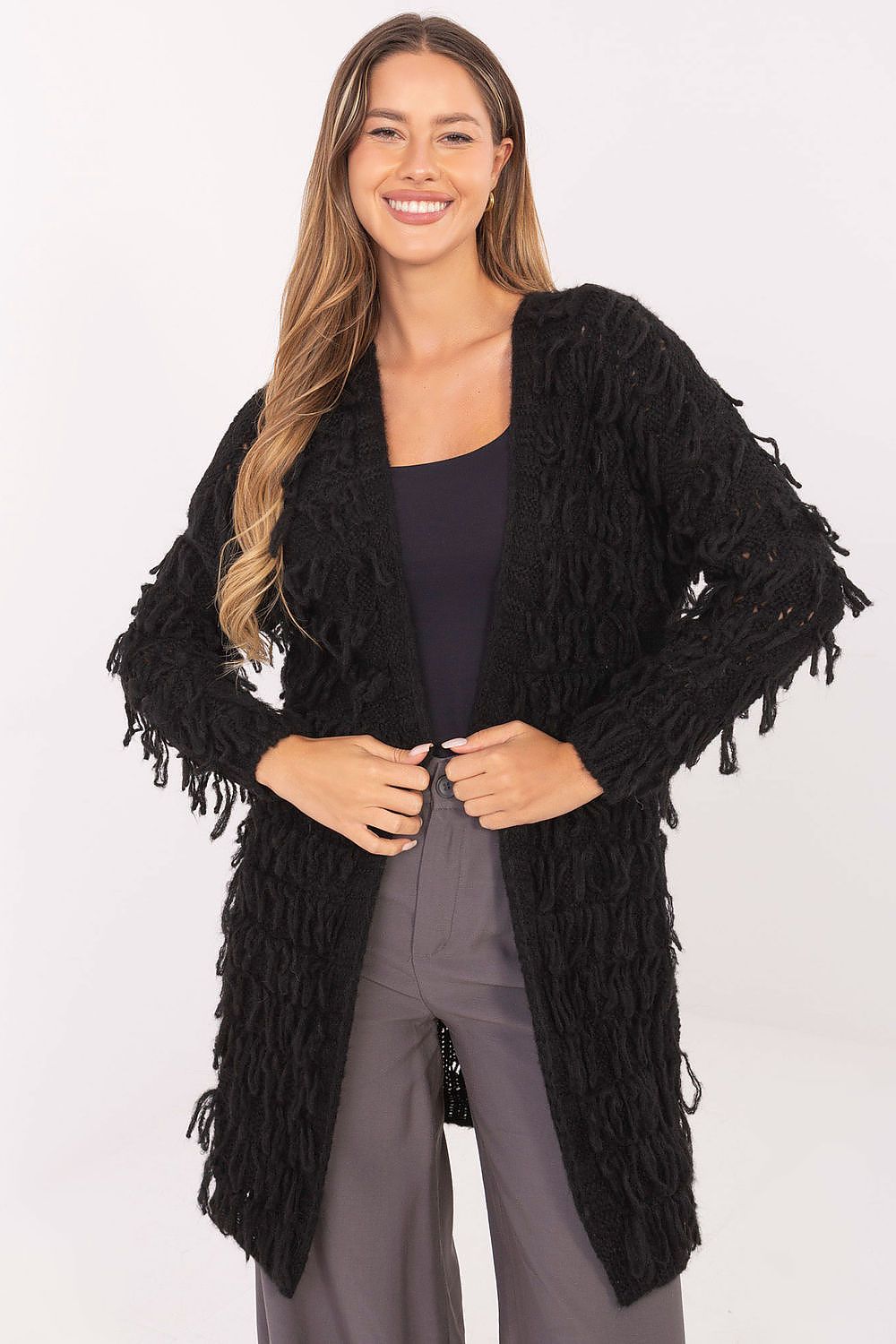 Front view of black women’s knit cardigan with fringe details and open front.