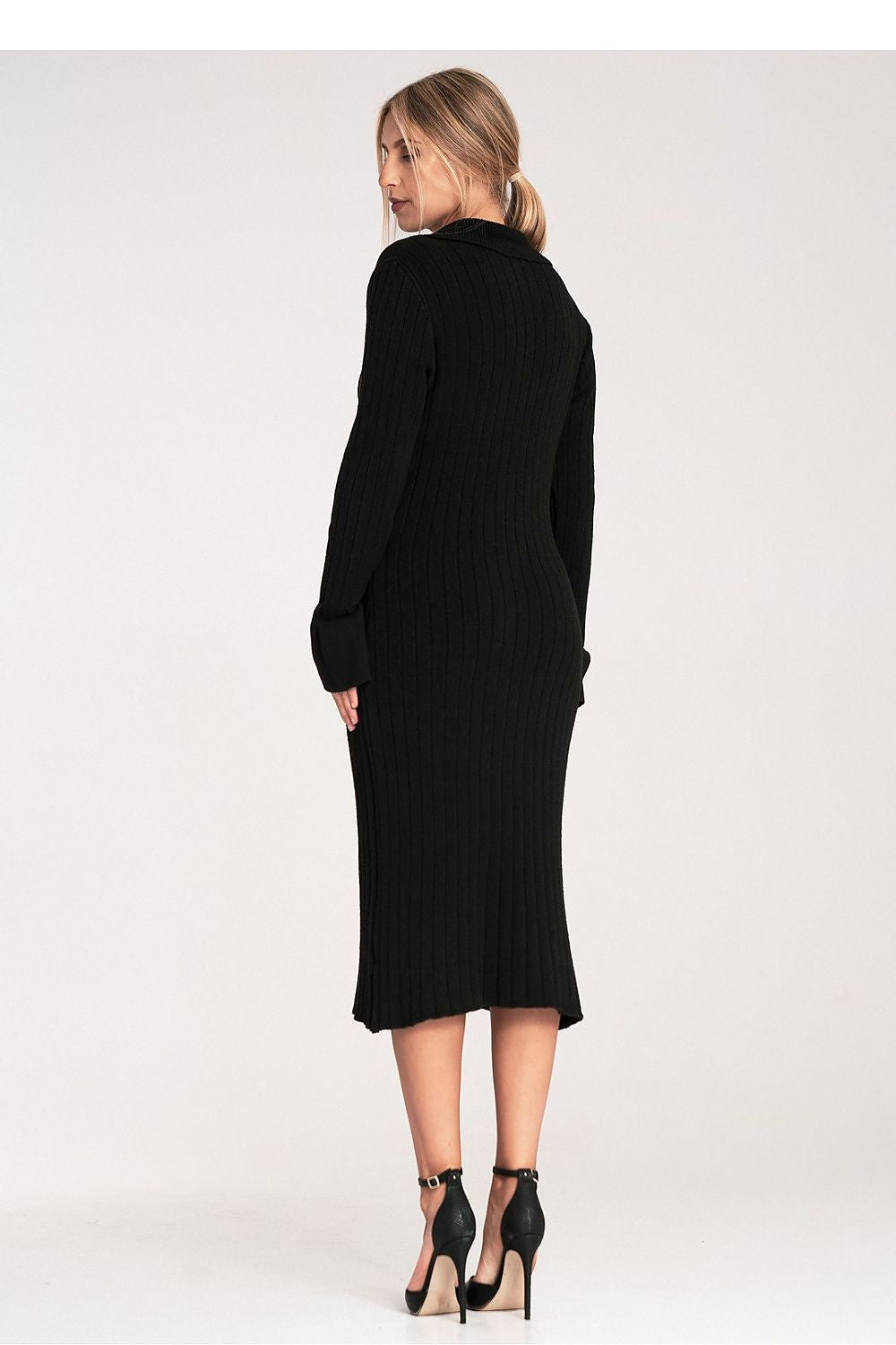 Woman wearing a black dress on a white background