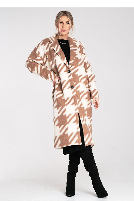 Woman wearing a patterned coat on a white background