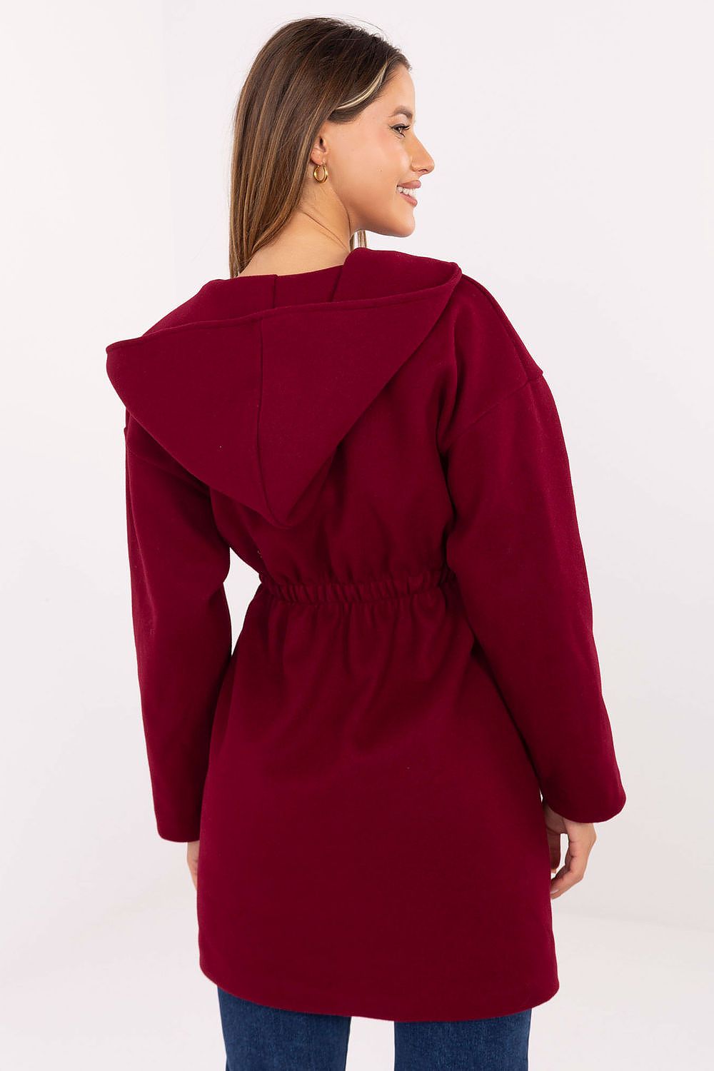 Back view of red coat highlighting oversized hood.