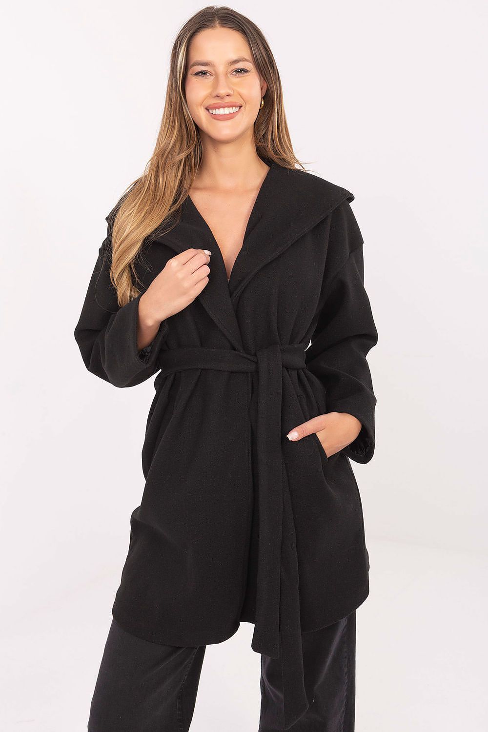 Front view of black women’s hooded coat with belt and pockets.