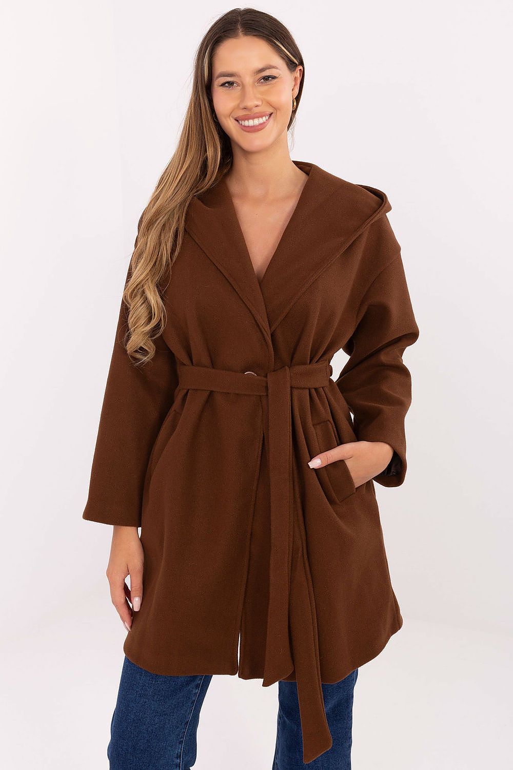Front view of brown hooded women’s belted coat with pockets and belt.