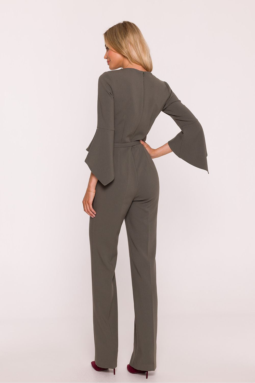 Woman wearing a gray suit on a white background