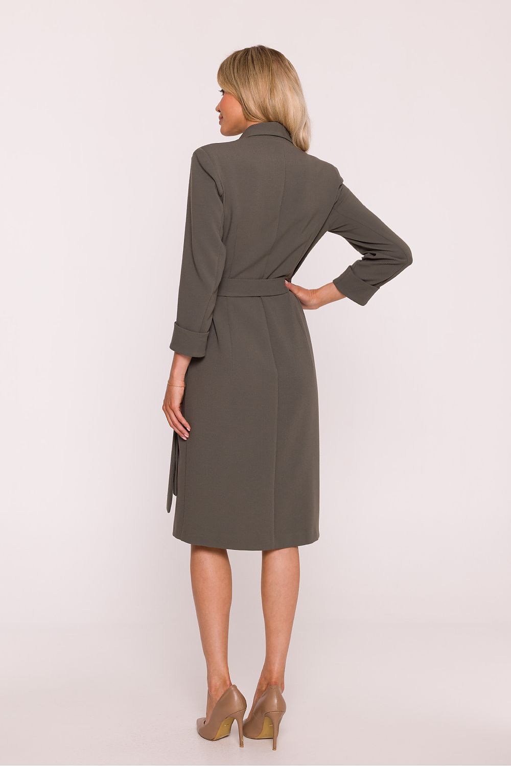 Woman wearing a gray coat on a white background