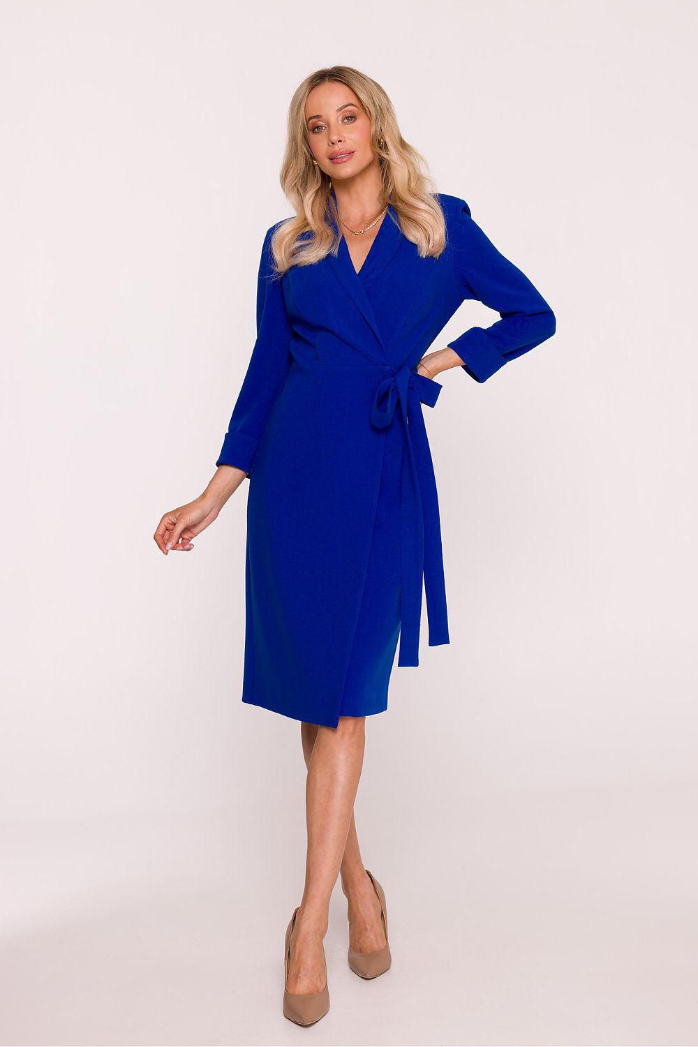 Woman wearing a blue dress on a white background