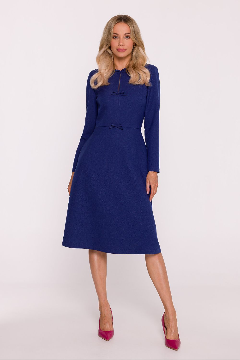 Woman wearing a blue dress on a white background