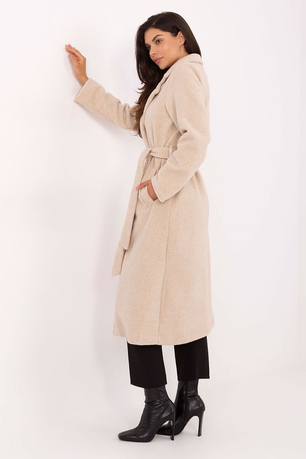 Beige bouclé coat side view showing textured material and waist tie