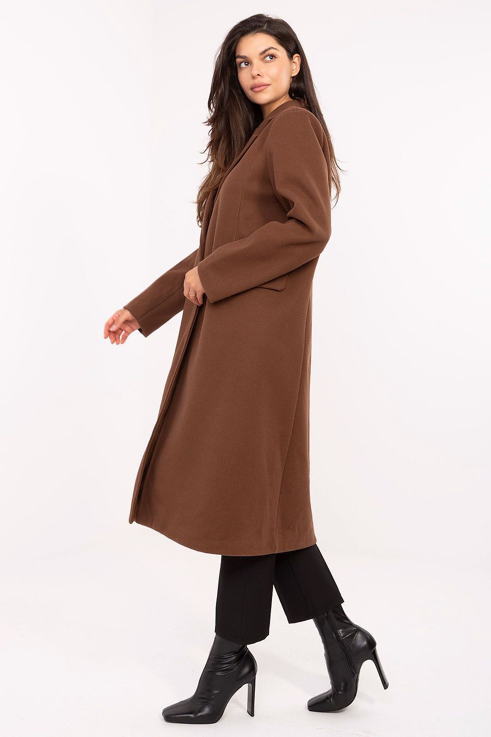 Woman wearing a brown coat on a white background