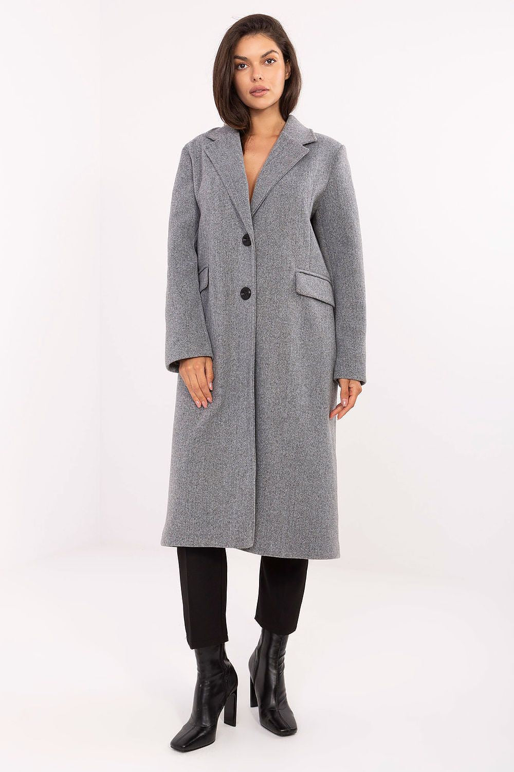 Woman wearing a gray coat on a white background