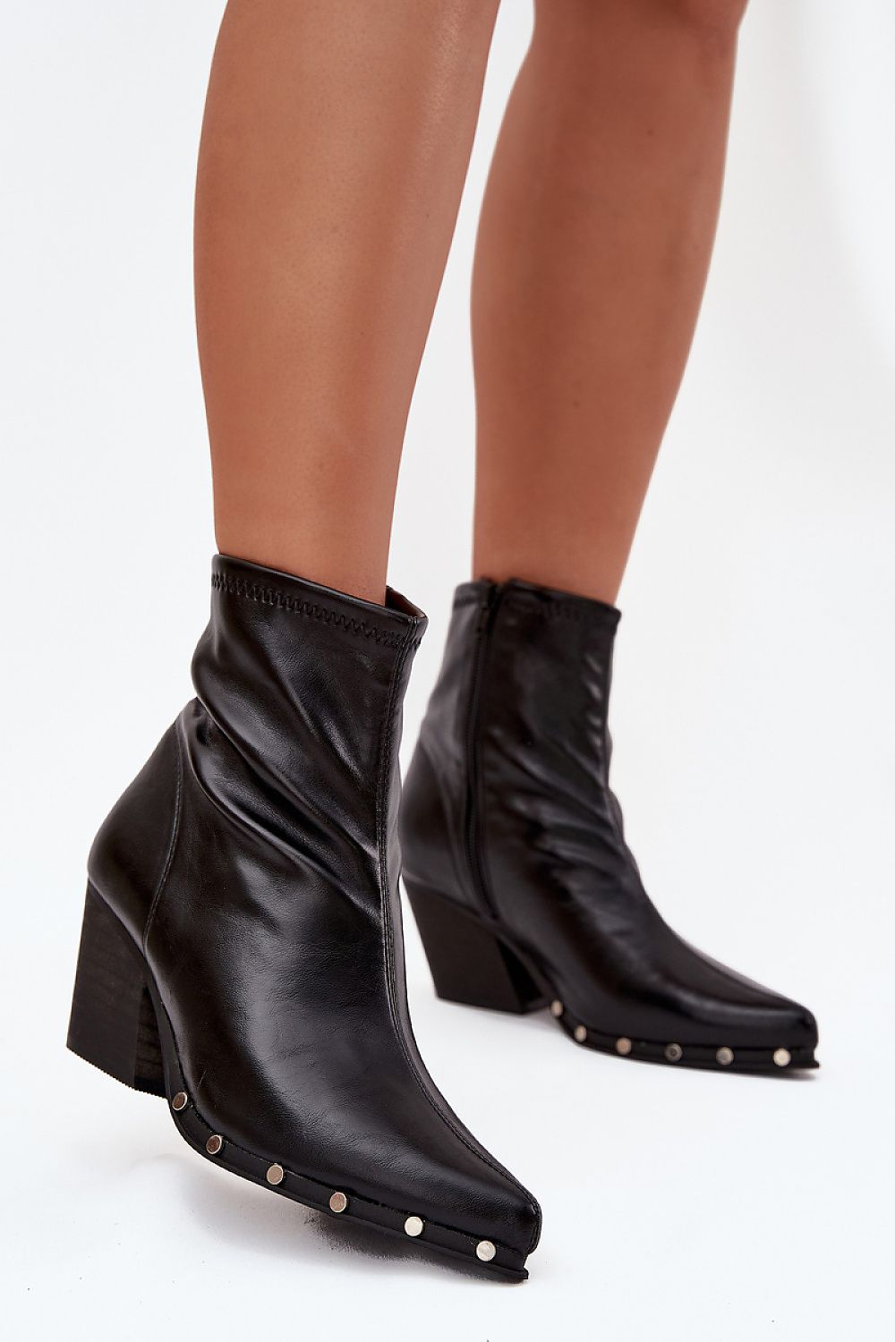 Front view of Raven Women’s cowboy boots in black with pointed toes and block heel.