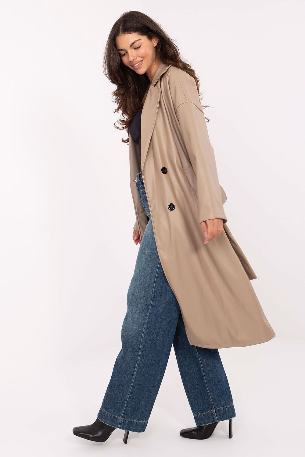Side view emphasizing elegant knee-length cut and double-breasted buttons.