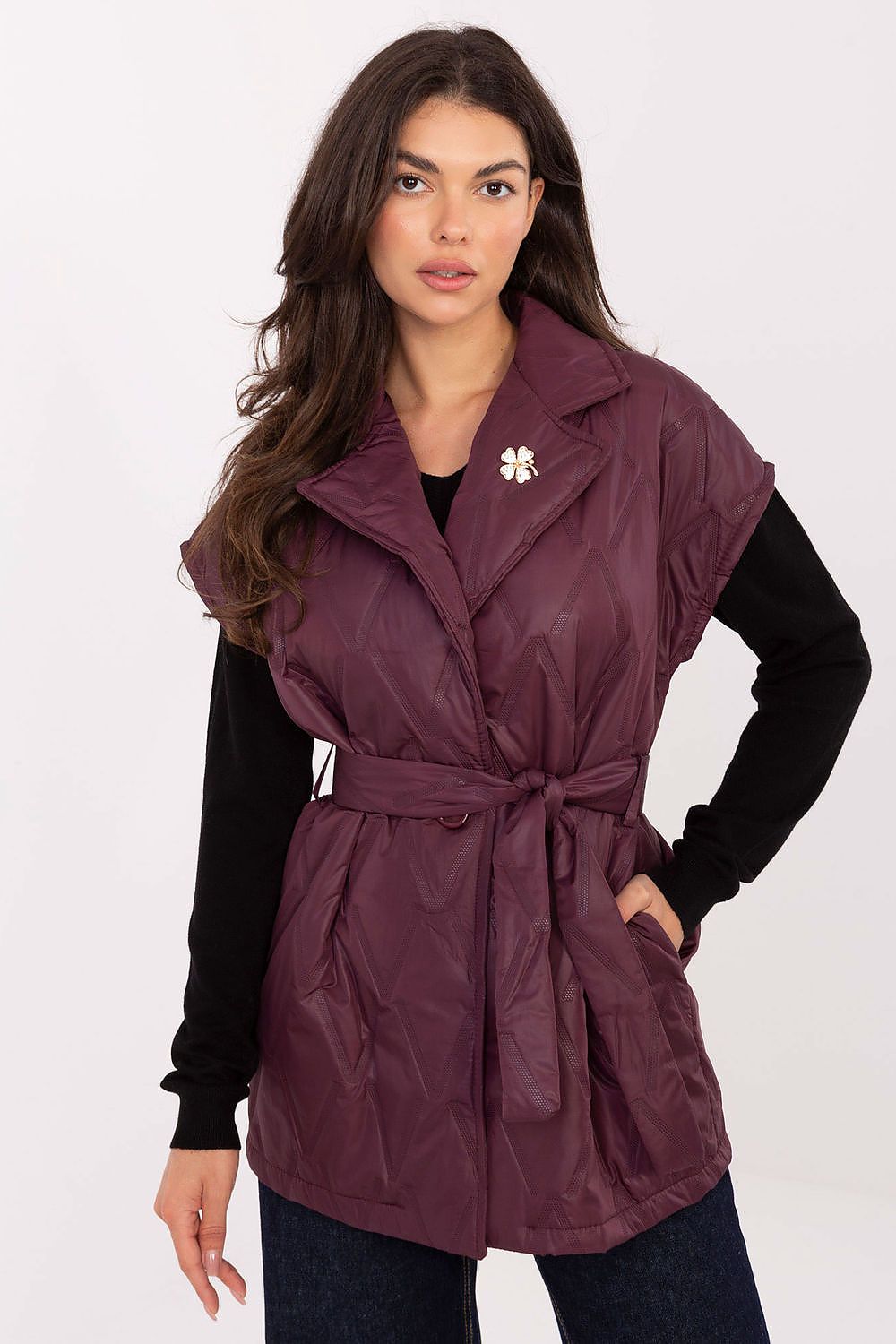  Front view of Elara Women’s quilted vest in deep red with lapels and button fastening.
