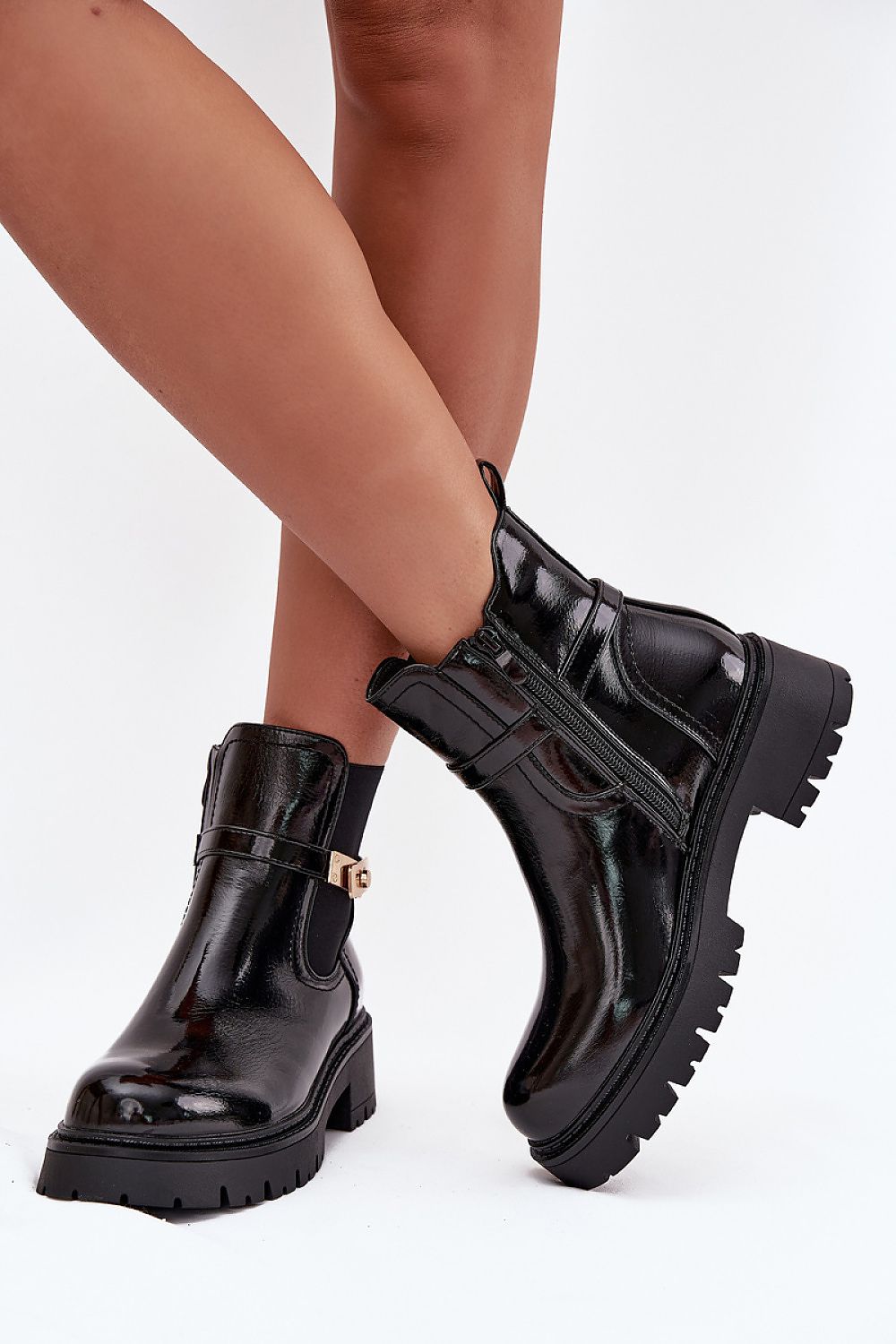 Front view of Aria Women’s platform ankle boots with rounded toes and flat heel.