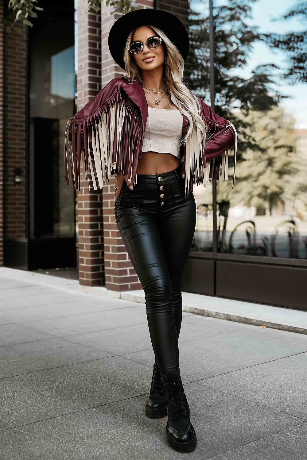  Front view 3 of Vega Women’s Burgundy Fringed Biker Jacket showing asymmetrical cut and contrasting fringes.