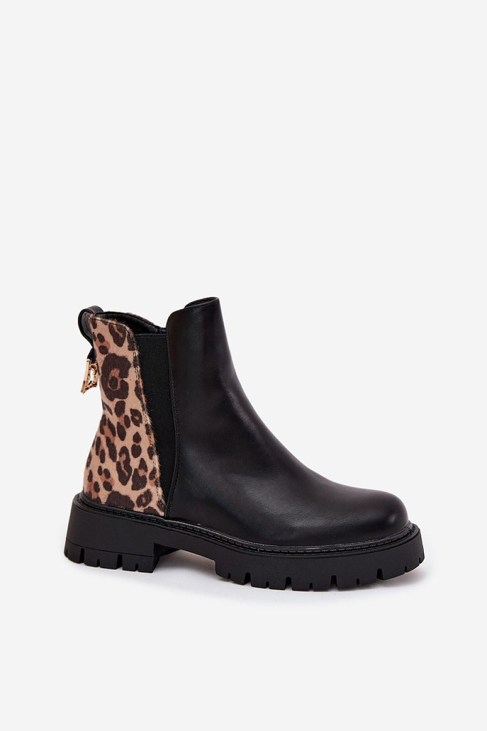 Black Chelsea boot with leopard print side panel on a white background