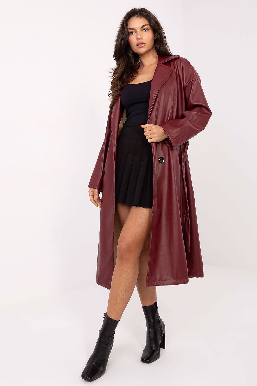 Front view of Celeste Women’s leather coat in deep red with lapels and tie belt.