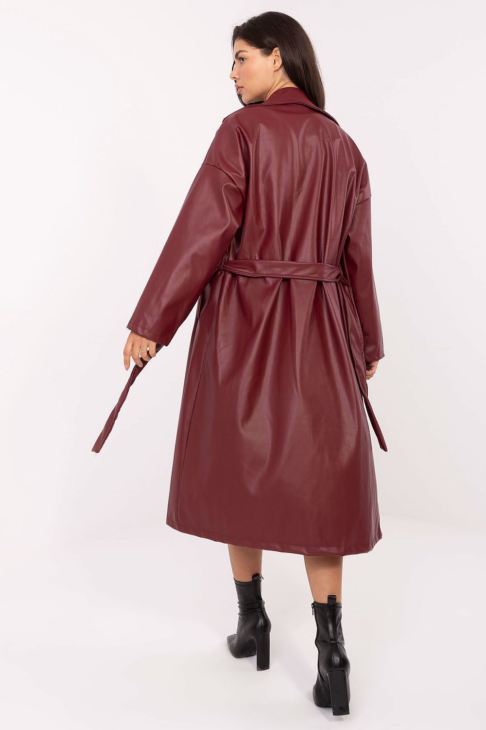 Back view of Celeste red leather coat showing feminine silhouette and belt.