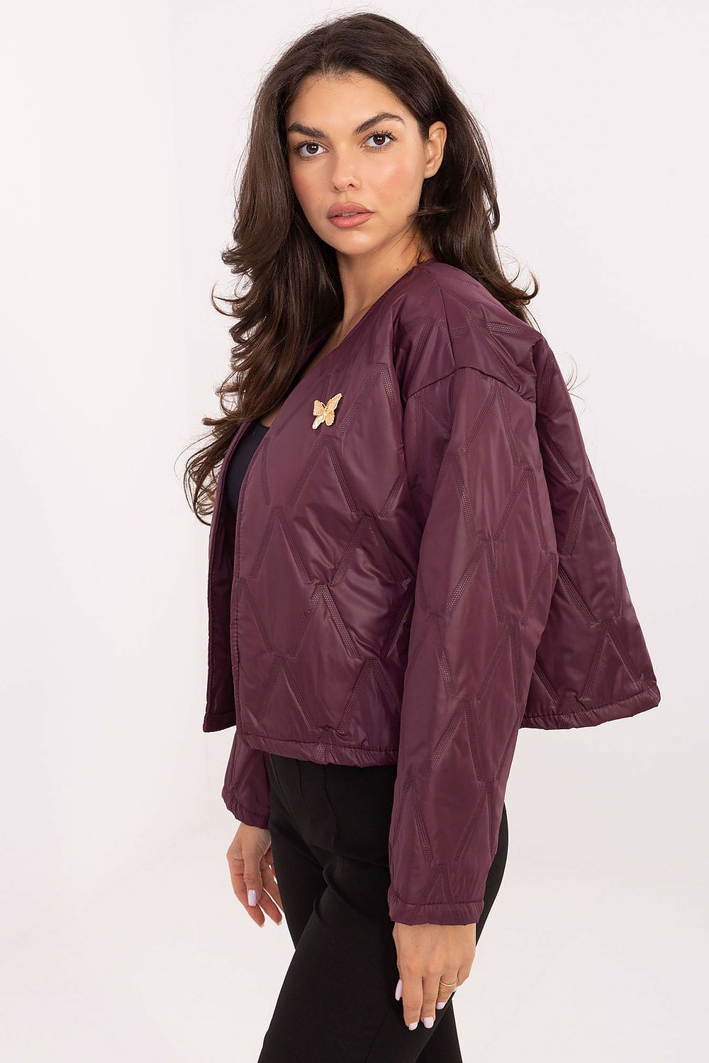 Side view highlighting lightweight fit and textured polyester fabric of Selene quilted jacket.
