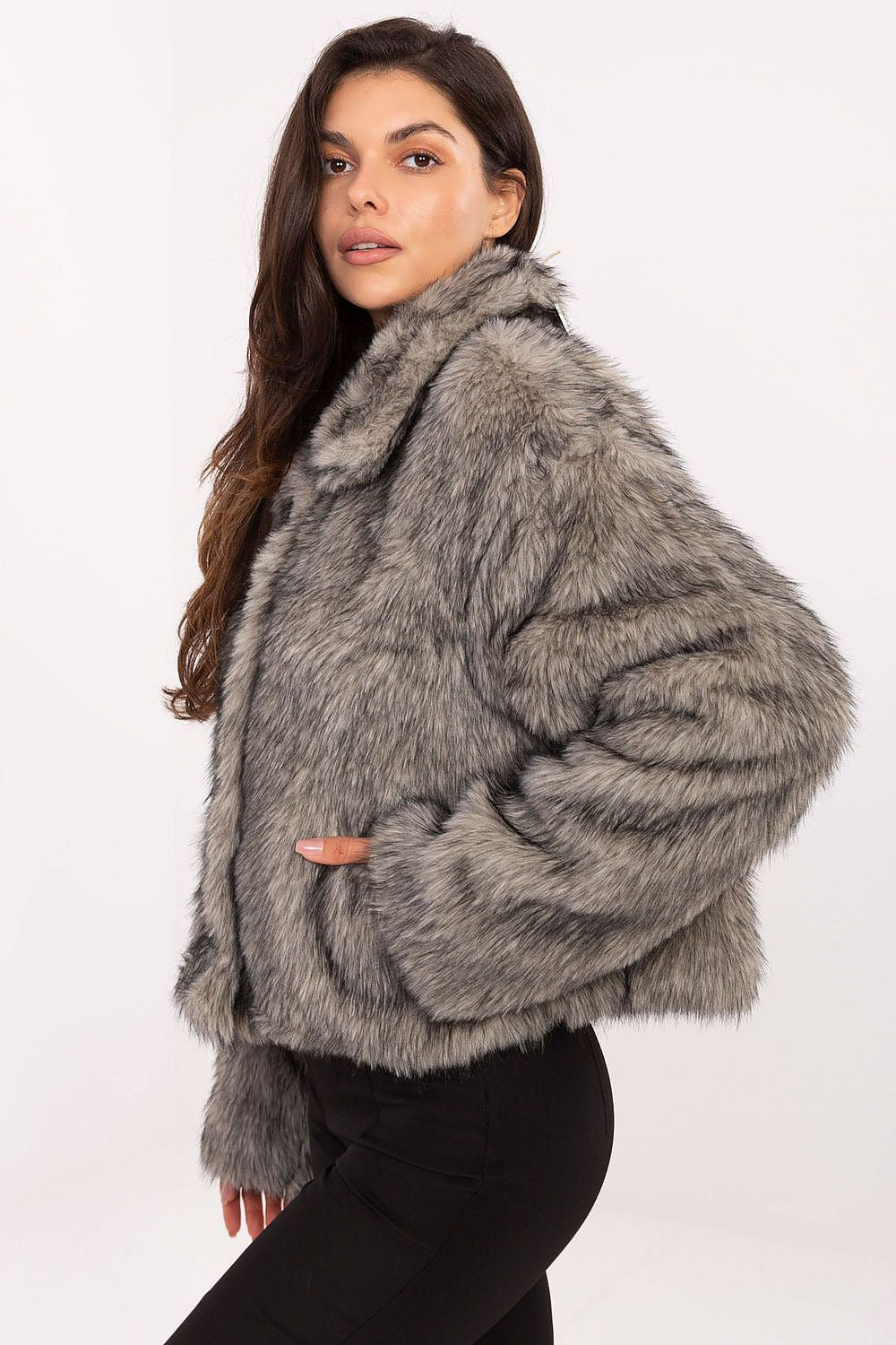 Side view showing long sleeves, textured fabric, and practical slip pockets of Aurora Women’s fur jacket.