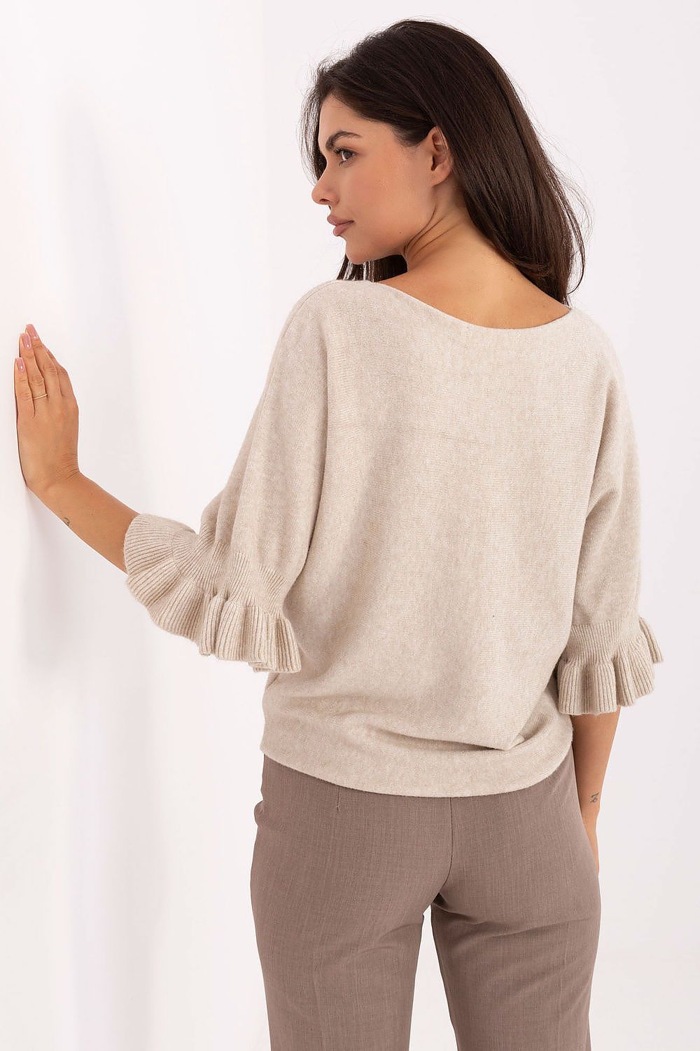  Back view of timeless women’s elegant sweater in smooth knit design.