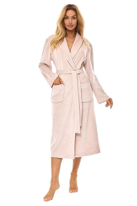 Woman wearing a light pink robe on a white background