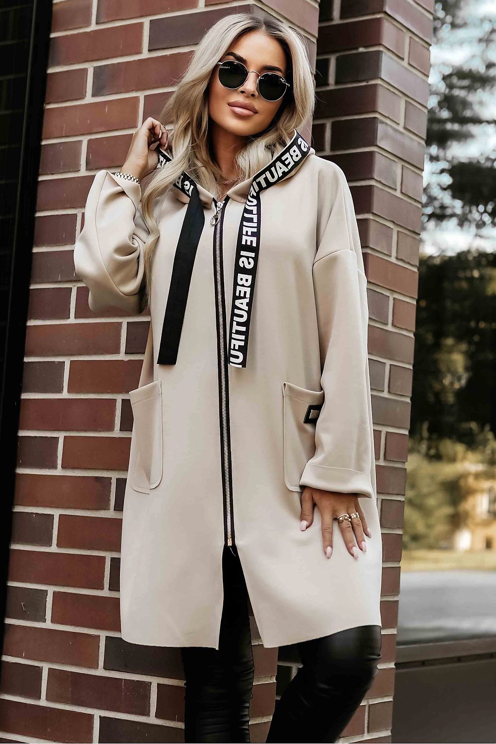Front view of beige Numoco Basic women’s hooded coat with drawstring detail. 1
