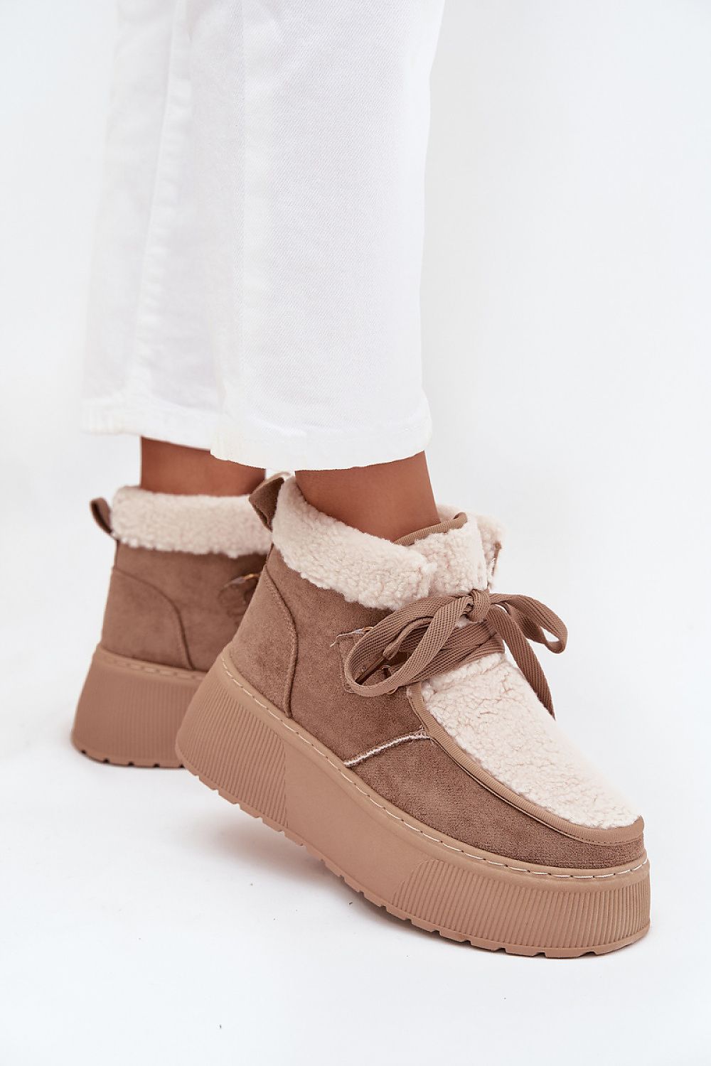 Side view highlighting fur-lined interior and soft eco suede texture of Noelle beige snow boots.