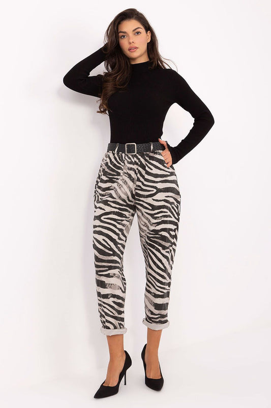  Women’s zebra print tapered trousers with high waist and buttoned belt.