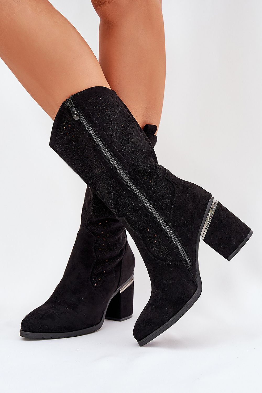 Side view showing zipper closure and chic suede texture of black S.Barski boots.