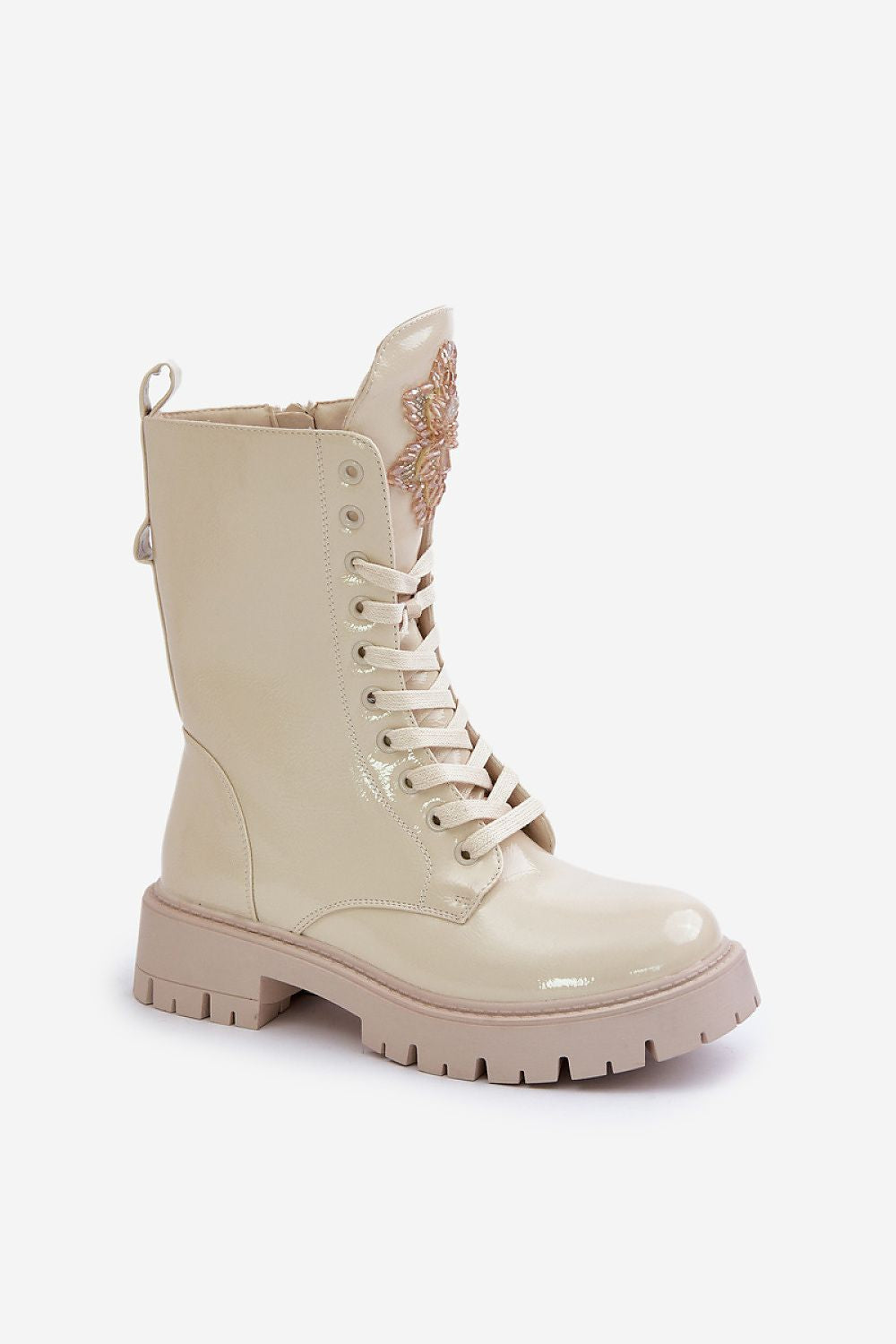 Standalone image of stylish women’s lacquered work boots