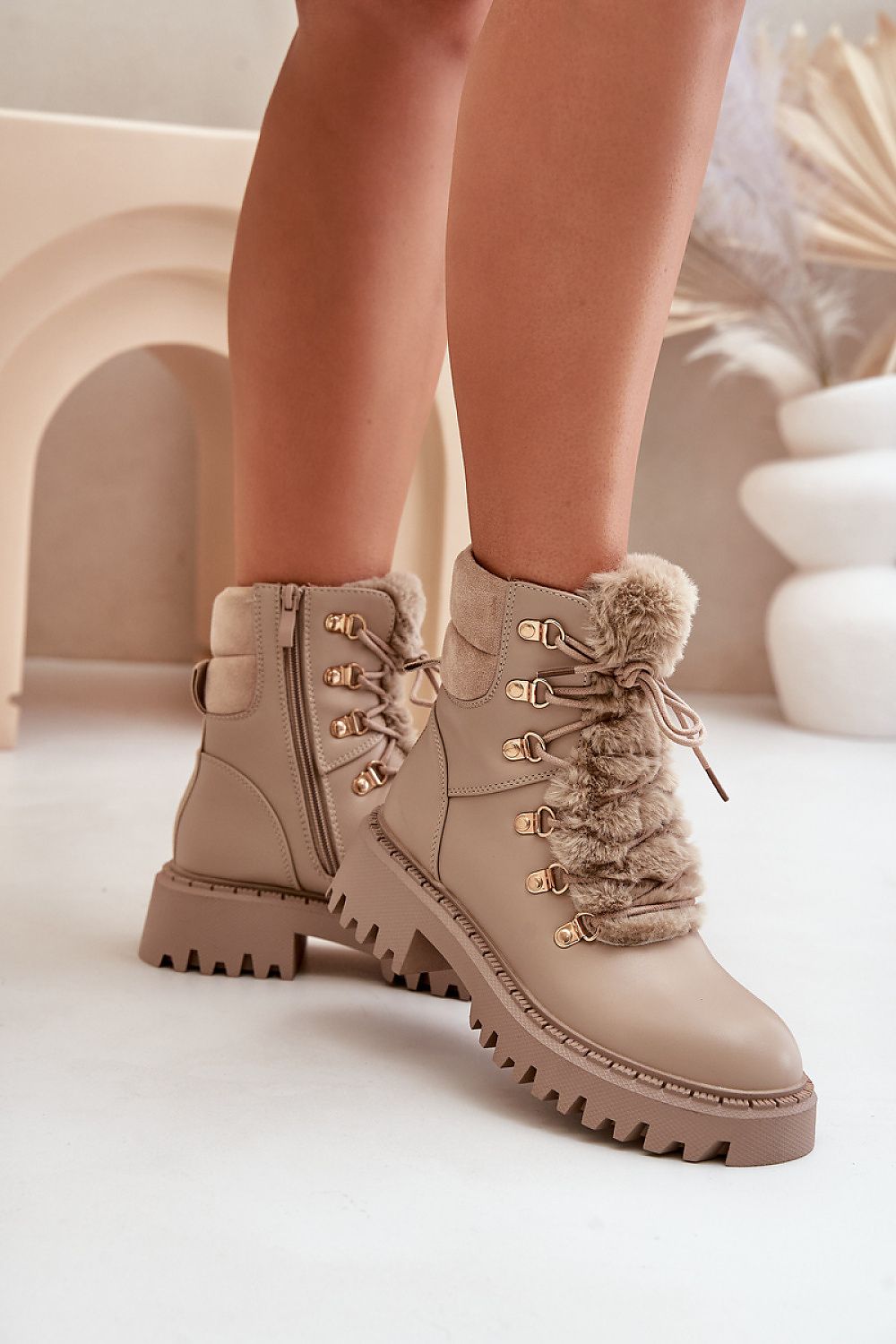 Front view of beige women's eco leather ankle boots with fur tongue