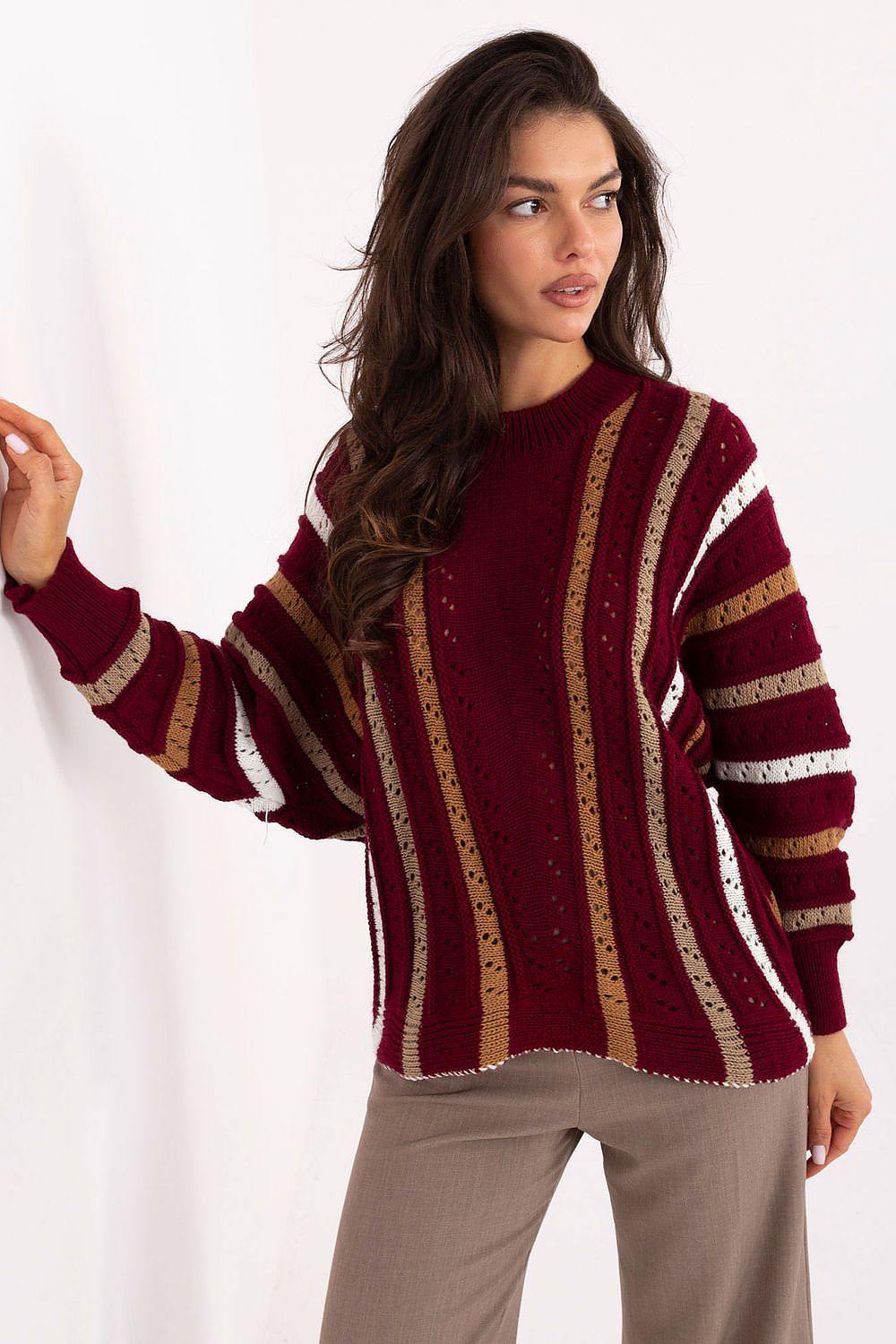 Red women’s openwork sweater with striped pattern and relaxed fit.