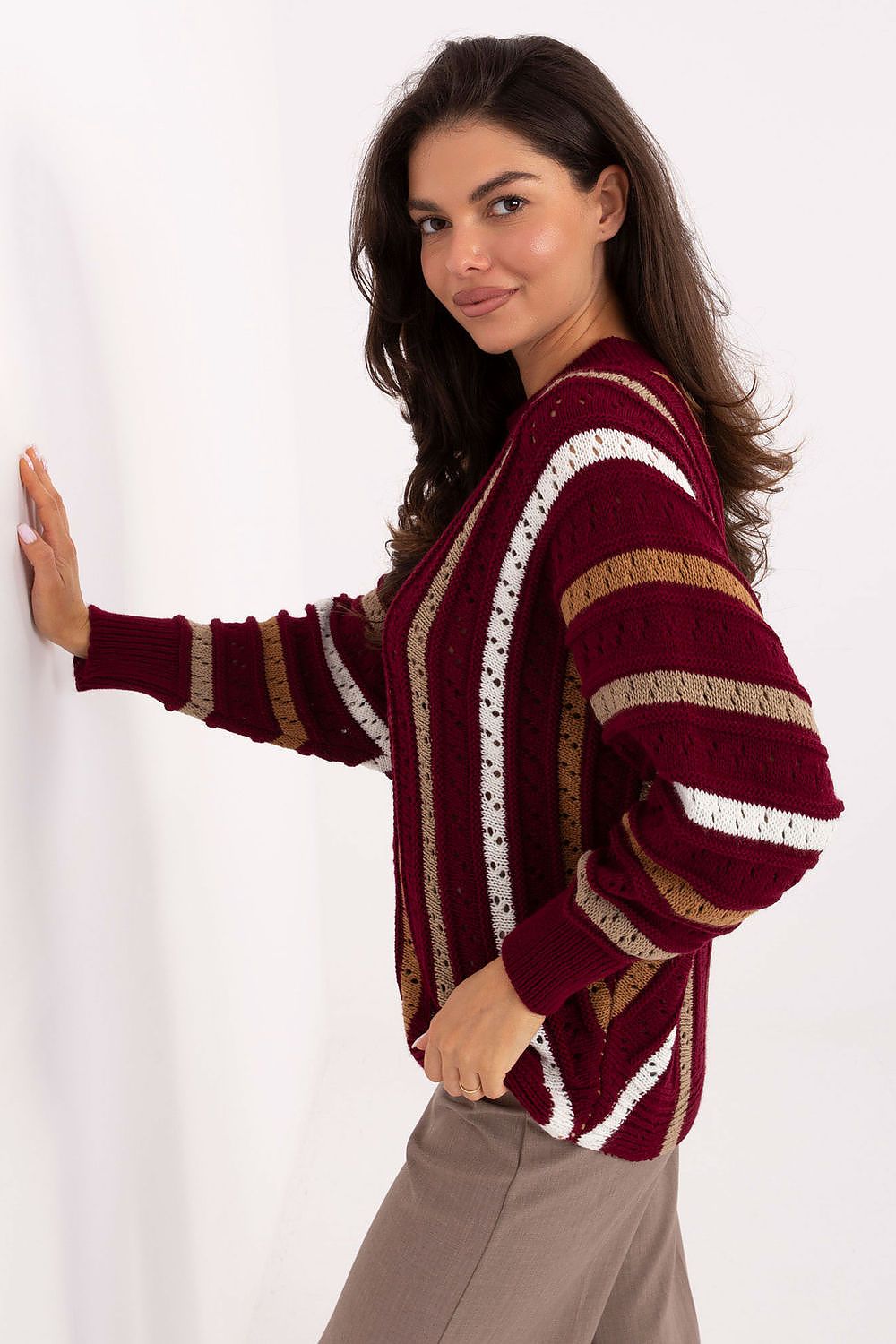 Bright red oversized knit sweater with round neckline and long sleeves.