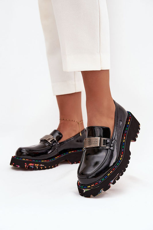 Side view of patent leather moccasins showing elegant finish and classic design