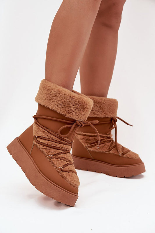 Front view of brown women’s platform snow boots with fur lining and laces
