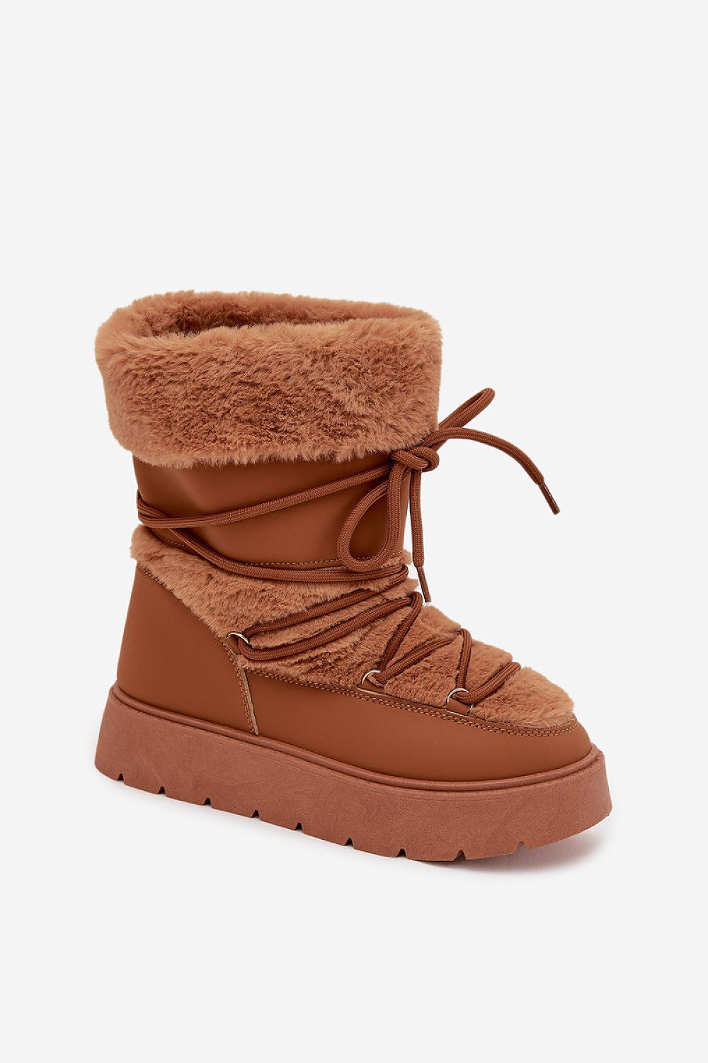 Standalone image of brown women’s snow boots with fur inside and outside