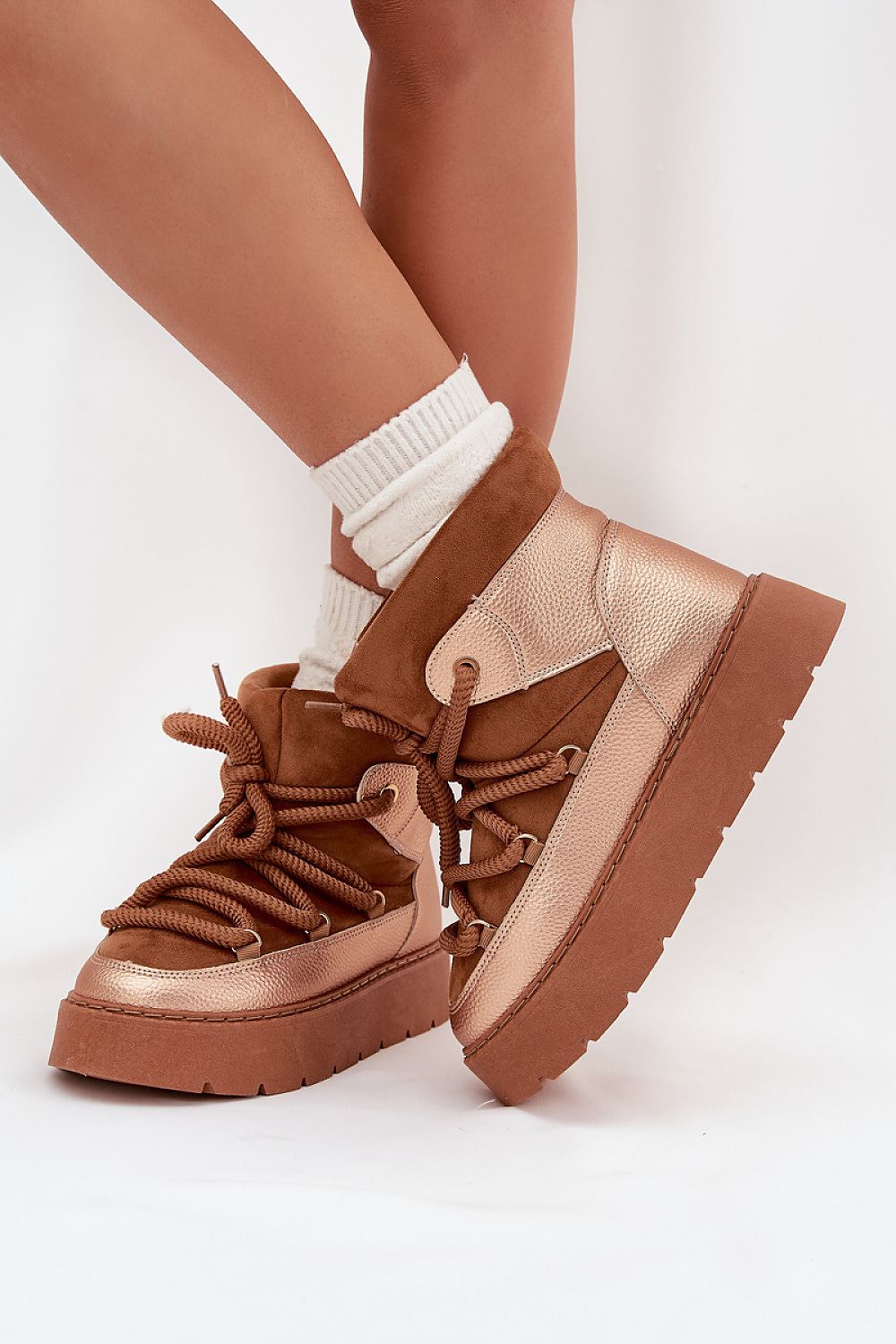Side view brown of eco suede and eco leather snow boots on a platform sole