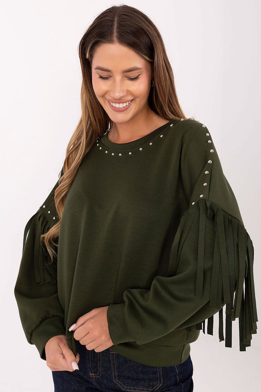 Model wearing studded fringe sweatshirt front view – Woman in a smooth casual sweatshirt with a studded neckline and fringe-detailed sleeves.
