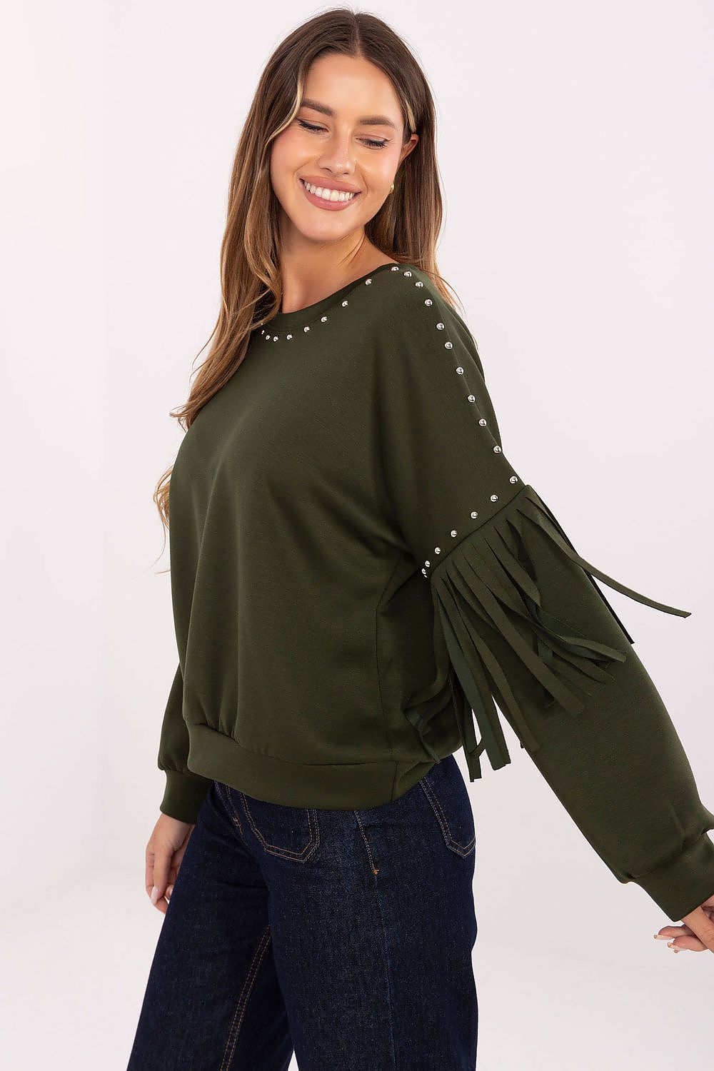 Close-up of neckline and sleeve details – Detailed shot highlighting the decorative studs and fringe embellishments on the women’s sweatshirt.