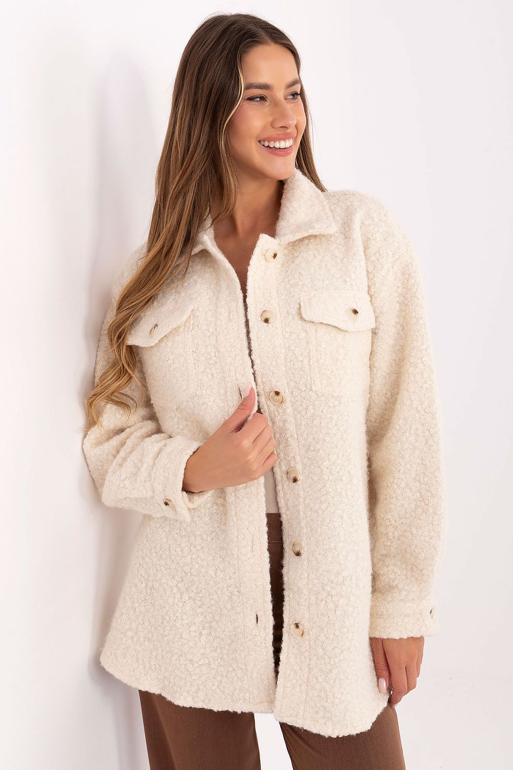 Beige bouclé women’s shirt with flap pockets and button closure, front view.