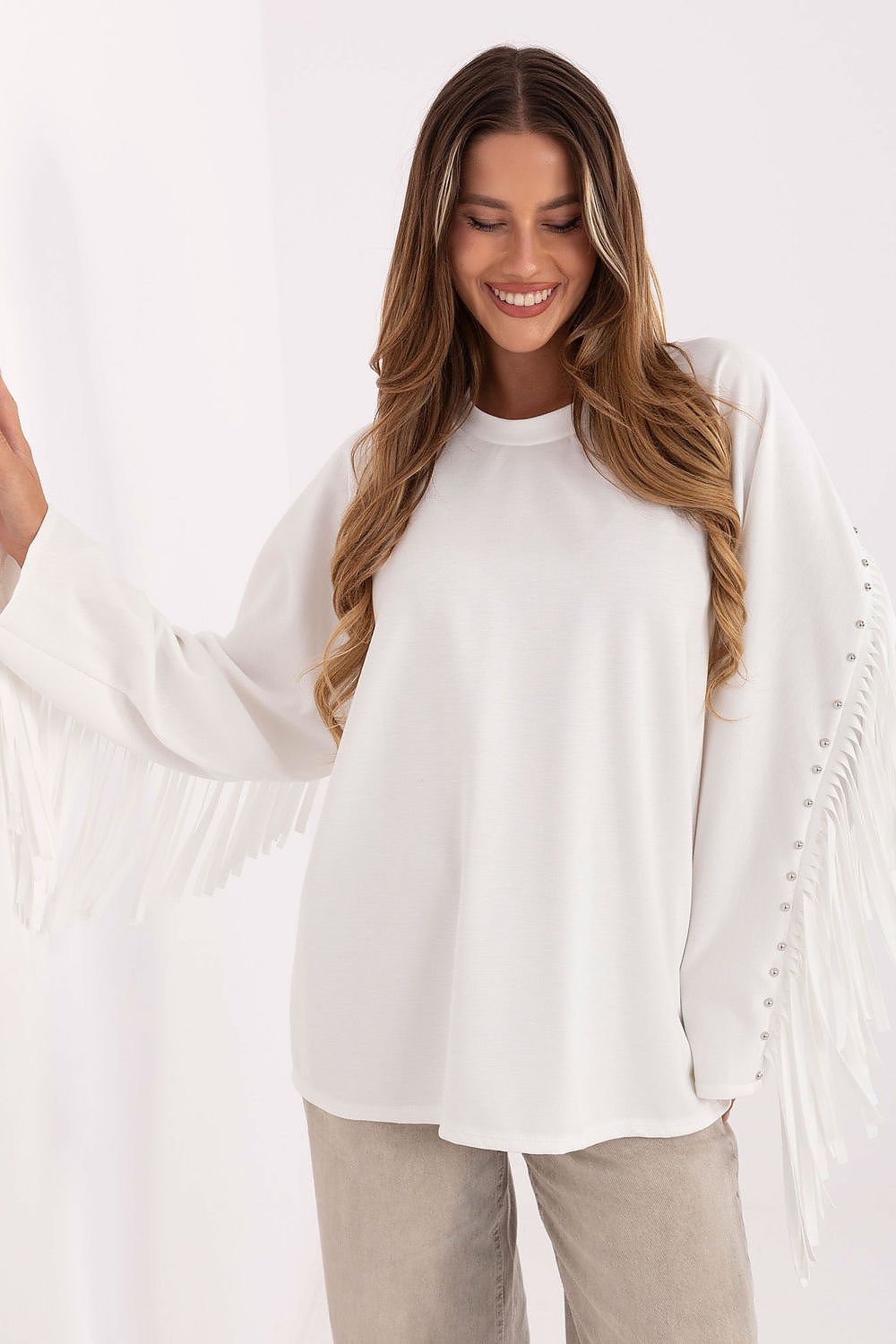 White casual sweatshirt featuring fringes and studs on long sleeves